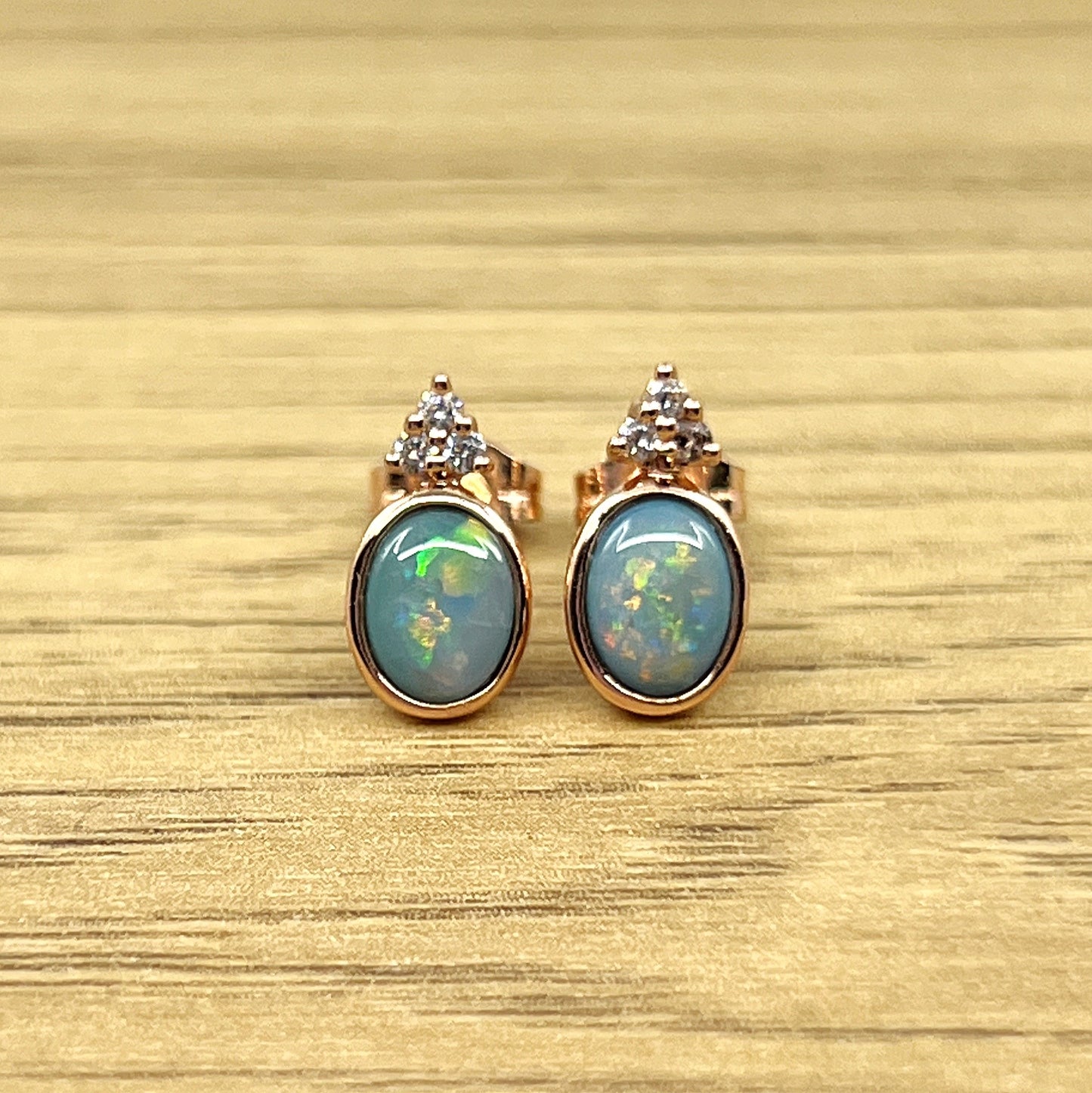 Rose Gold Plated Doublet Opal Stud Earrings with Cubic Zirconia in hues of red and orange