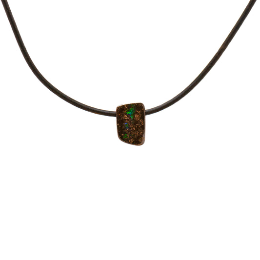 Vibrant Queensland Boulder Opal Pendant on a sleek neoprene cord, bursting with joyful greens and dazzling flashes of red, yellow, and blue | Opalist