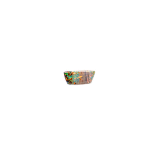 A 1.46ct Loose Queensland Boulder Opal in a free-form trapezium shape, featuring striking bands of red and green with flashes of blue. A small but impactful gemstone ideal for custom jewellery | Opalist